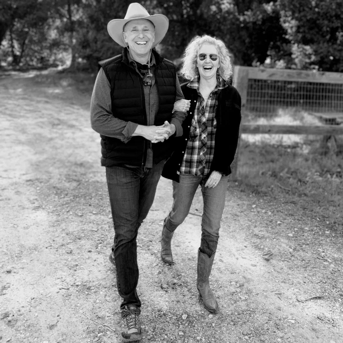 Album cover — a black-and-white photograph of two people walking hand in hand along a dirt road